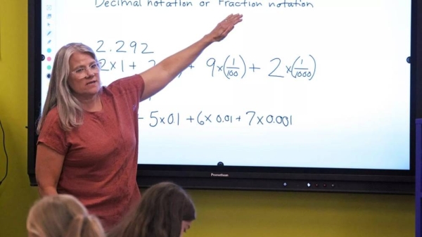 Math teacher Margie Howells teaches a fifth grade class at Wheeling Country Day School in Wheeling, W.Va., on Sept. 5, 2023
