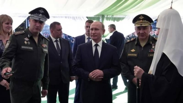 Russia's deputy defence minister Timur Ivanov, left, alongside President Vladimir Putin and Defence Minister Sergei Shoigu