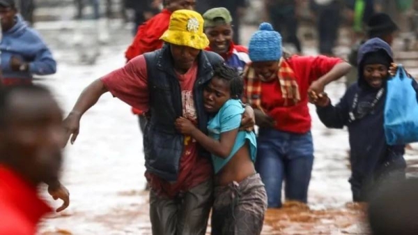 Locals rescue stranded residents who were trapped in their flooded homes in Nairobi. — courtesy EPA