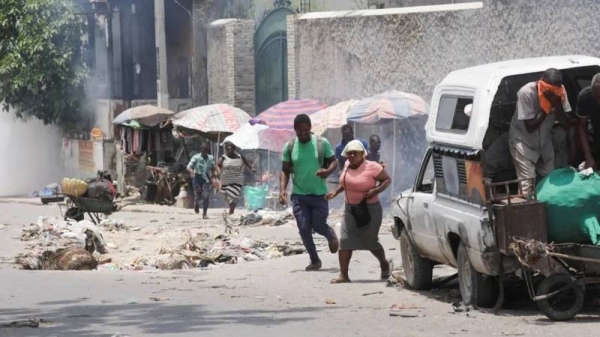 Police used tear gas on crowds near the National Palace ahead of the ceremony swearing in members of Haiti's transitional presidential council