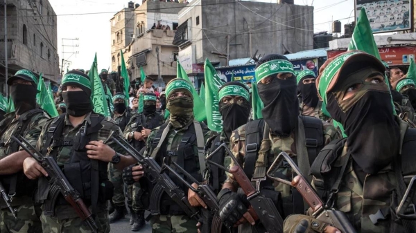 Palestinian fighters are seen during a military show in the Bani Suheila district on July 20, 2017 in Gaza City, Gaza