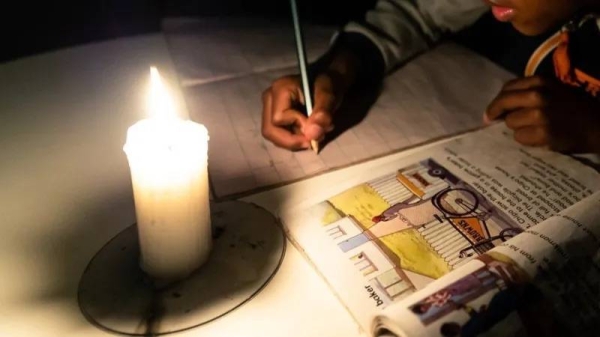 Schoolchildren have been studying by candlight (file photo). — courtesy AFP