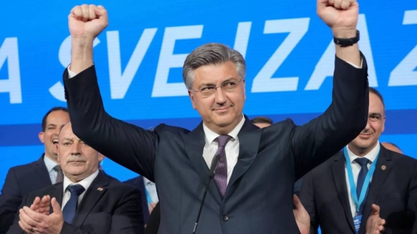 Prime Minister incumbent Andrej Plenkovic celebrates after claiming victory in a parliamentary election in Zagreb, Croatia, Thursday, April 18, 2024