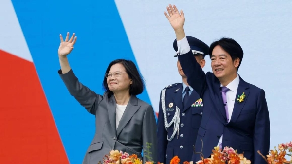 Taiwan's former President Tsai Ing-wen and new President Lai Ching-te wave during Lai's inauguration ceremony in Taipei on May 20