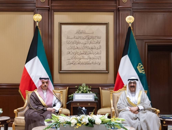 Kuwait’s Amir Sheikh Meshal Al-Ahmad Al-Jaber Al-Sabah holds talks with Saudi Minister of Foreign Affairs Prince Faisal bin Farhan at Bayan Palace in Kuwait City on Monday.