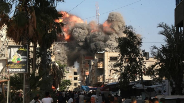 A ball of fire and black smoke rises moments after an Israeli air strike in Bureij, central Gaza, on June 3, 2024