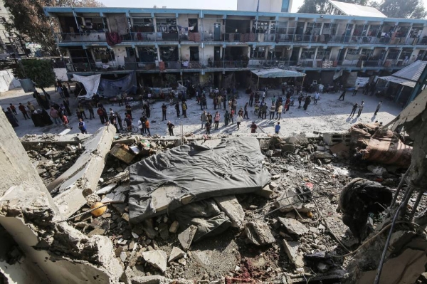 06 June 2024, Palestinian Territories, Deir el-Balah: Palestinians inspect damages after an Israeli airstrike on a school for displaced people run by the United Nations Relief and Works Agency for Palestine Refugees in the Near East (UNRWA) in Nuseirat refugee camp in the middle of the Gaza Strip. Photo by: Omar Naaman/picture-alliance/dpa/AP Images

Palestinians inspect damage after an Israeli airstrike on a United Nations-run school in Deir El-Balah, Gaza, on June 6. Omar Naaman/dpa/AP