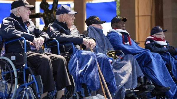 World War II veterans listen during a ceremony to mark the 80th anniversary of D-Day, Thursday, June 6, 2024, in Normandy