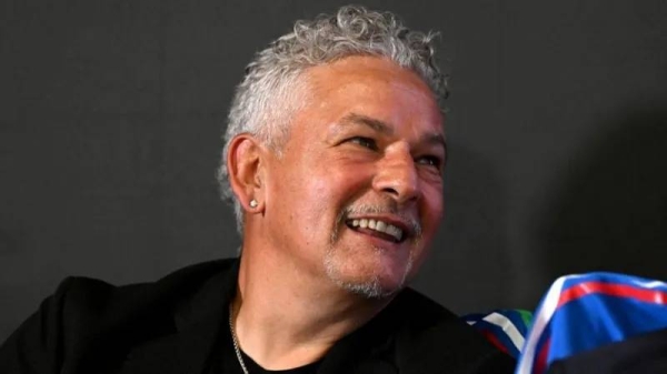 Roberto Baggio smiles during a press conference