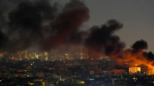 Smoke was seen rising over Beirut's southern suburbs after Israeli air strikes late on Sunday