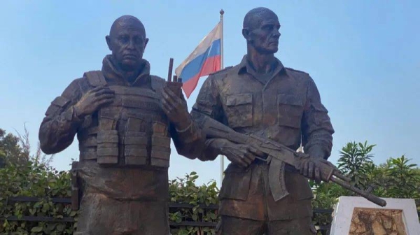 A bronze statue in the likeness of the late Wagner private mercenary group chief Yevgeny Prigozhin (L), and his right-hand man Dmitru Utkin (R), erected in front of the Maison Russe Russian House in Bangui
