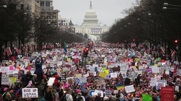 Protesters walk up Pennsylvania Avenue during the Women's March on Washington on January 21, 2017, in Washington, DC