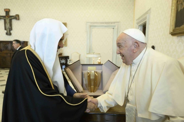 Pope Francis receives Muslim World League Secretary General Sheikh Muhammad Al-Issa at the Pope's office in Vatican City.
