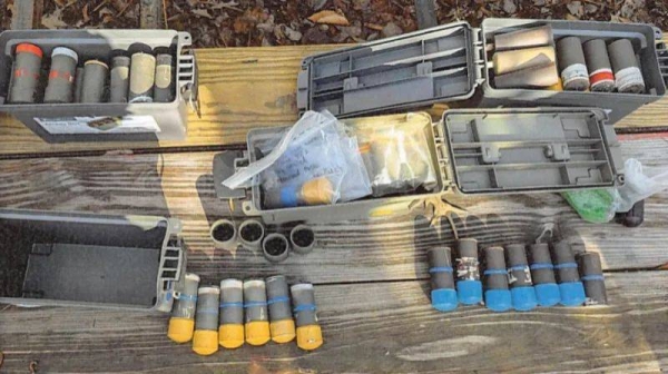 FBI Several multi-colored pipe bombs laid out on a table