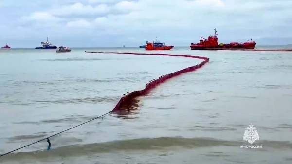 Russian rescuers work to clean up tons of oil that spilled out of two storm-stricken tankers in the southern Krasnodar region