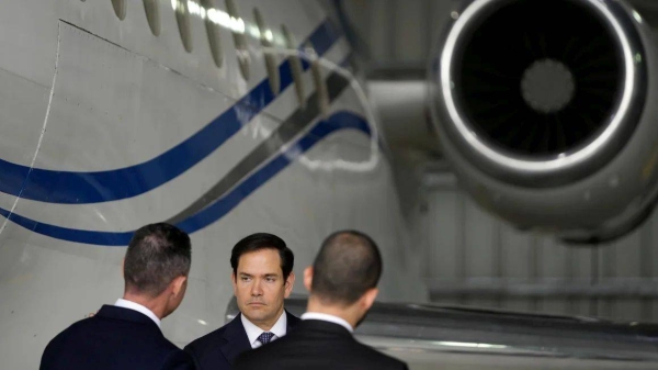 Secretary of State Marco Rubio stands by the Venezuelan government airplane he announced is being seized during a press conference in the Dominican Republic, on February 6, 2025