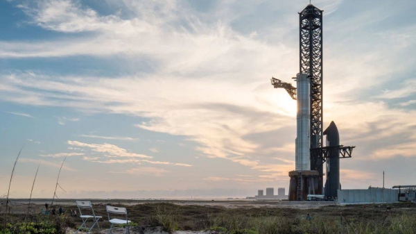 The eight integrated test flight of the SpaceX Starship rocket system was called off Monday. The Starship spacecraft is shown sitting to the right of the launch tower beside the Super Heavy booster