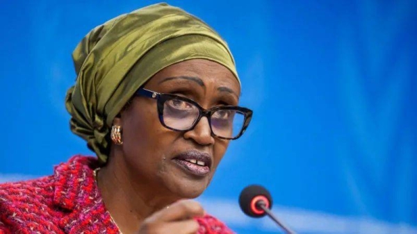 Winnie Byanyima speaking into a microphone at the UN offices in Geneva