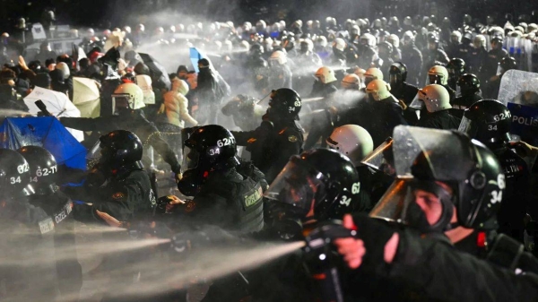 Turkish riot police officers use pepper spray to disperse protesters in Istanbul on March 23 during a demonstration against the jailing of Istanbul Mayor Ekrem Imamoglu