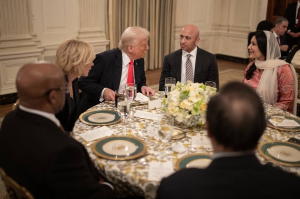 US President Donald Trump speaks with Saudi Ambassador to Washington Princess Reema bint Bandar during the iftar. 