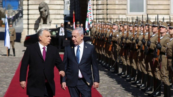 Hungarian Prime Minister Viktor Orban and Israeli Prime Minister Benjamin Netanyahu walk on the red carpet during a welcoming ceremony at the Lion's Courtyard in Budapest, Hungary, on Thursday