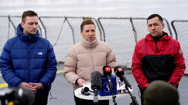 Danish Prime Minister Mette Frederiksen, center, attends a news conference aboard a Danish navy ship in Nuuk, Greenland, on Thursday