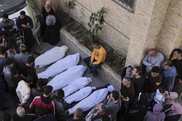 Palestinians grieve over the bodies of their relatives, who were killed in an Israeli airstrike, at the Baptist Hospital in Gaza City, on Thursday, April 3, 2025