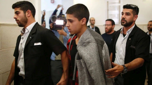 Ahmed Manasra leaves the District Court in Jerusalem after his sentencing hearing on November 7, 2016
