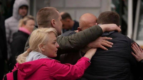 People were seen embracing and crying at the site of the attack in Sumy