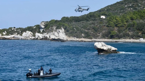 A helicopter and a coastguard vessel take part in a search and rescue operation after a boat carrying migrants ran into trouble off the coast of Samos, 23 September, 2024
