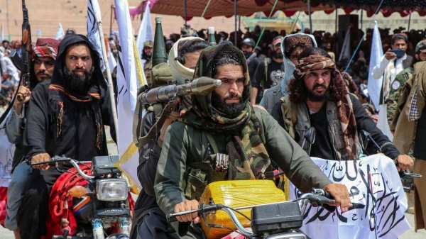 Taliban security personnel ride motorbikes as they celebrate the third anniversary of Taliban takeover of Afghanistan, in Khost, Afghanistan, on August 14, 2024
