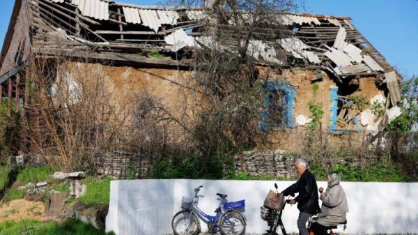 People arrive for the Orthodox Easter service at the Church of Archistratigus Michael which was damaged in the course of Russia-Ukraine conflict and is now being restored, in Avdiivka (Avdeyevka), in the Donetsk region, a Russian-controlled area of Ukraine, April 20, 2025.