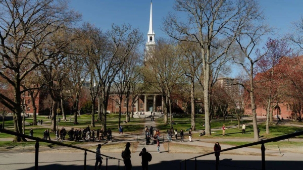 People cross Harvard Yard at Harvard University on Thursday in Cambridge, Massachusetts