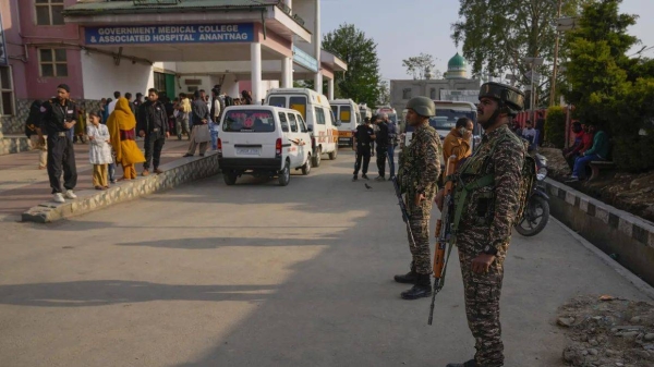 Indian security officers stand guard at a hospital in Jammu and Kashmir's Anantnag district after assailants fired at tourists in the tourist destination of Pahalgam on Tuesday