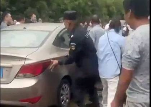 The scene after a car plowed into a crowd of people outside a school in Jinhua in the province of Zhejiang, China, on Tuesday