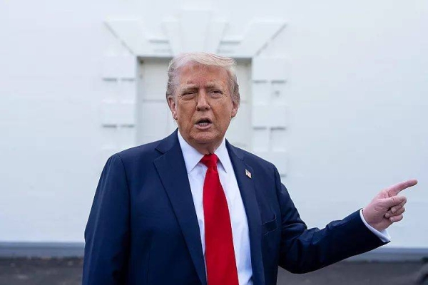 President Donald Trump speaks with reporters at the White House, 23 April, 2025