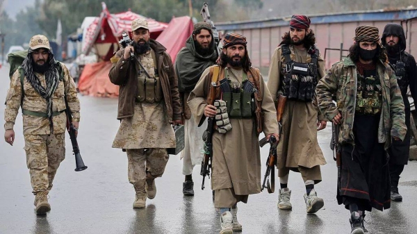 Taliban fighters patrol near the closed Torkham border with Pakistan, where Pakistani and Afghan forces exchanged fire overnight, Monday, March 3, 2025