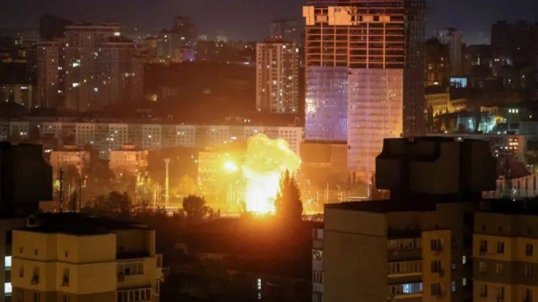 An explosion of a drone is seen in the sky over the city during a Russian drone strike on 24 April