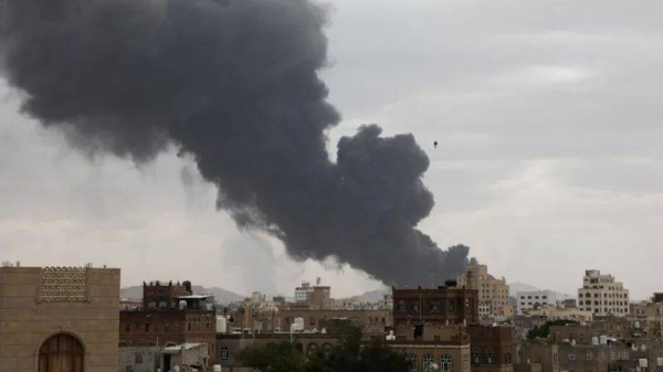 Smoke rises over the city of Sanaa, on 6 May, following an Israeli air strike