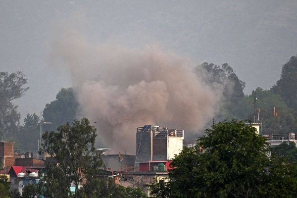 Smoke billows after an artillery shell landed in Poonch district in India's Jammu and Kashmir region on Wednesday.