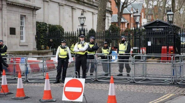 Police block the entrance to the Israeli embassy during a protest in March