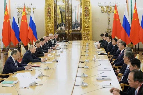 Russian President Vladimir Putin talks during meeting with Chinese President Xi Jinping at the Kremlin in Moscow, Russia, Thursday, May 8, 2025
