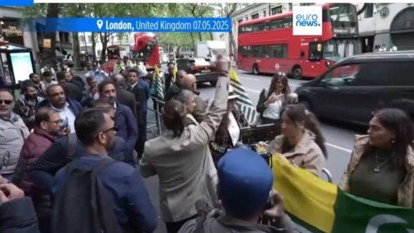 Demonstrators wave flags as they gather to protest outside the India High Commission, in London, Wednesday, May 7, 2025.