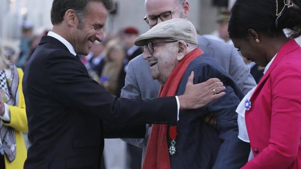 French President Emmanuel Macron awards French WWII resistant Jean Daikhowski with the Legion of Honor during ceremonies marking the 80th anniversary of the end of WWII
