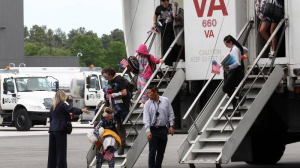 The first group of white South Africans land at Dulles Airport