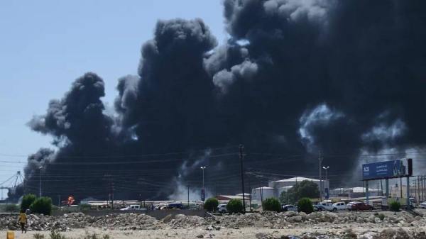 Smoke billows after drone strikes by the paramilitary Rapid Support Forces (RSF) targeted Port Sudan, Sudan, on 6 May, 2025