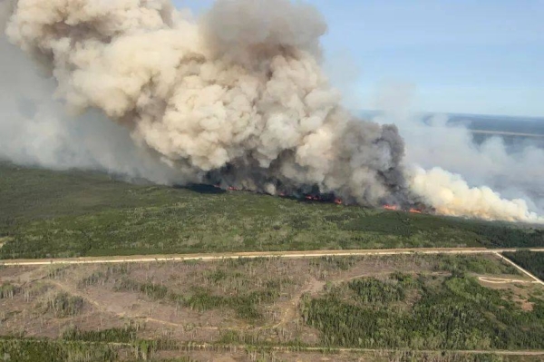 Smoke rises from wildfire near Wanless, Manitoba, Canada, on May 27, 2025