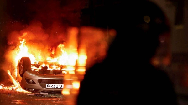 A vehicle burns during a second night of riots, in Ballymena, Northern Ireland, on June 11, 2025