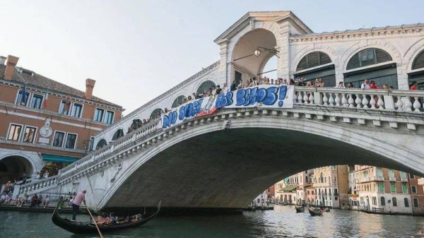 Activists unfurled various anti-Bezos banners around Venice