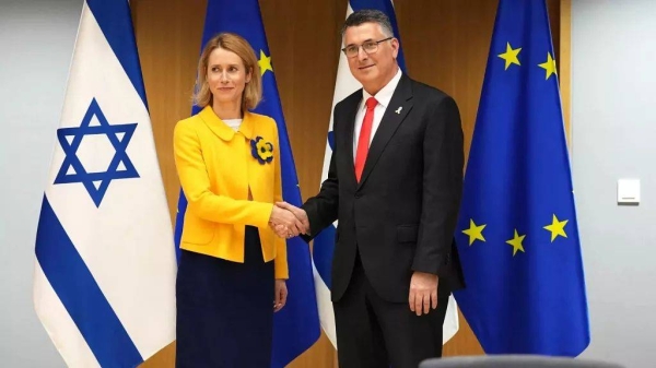European Union foreign policy chief Kaja Kallas, left, shakes hands with Israel's Foreign Minister Gideon Sa'ar during the EU-Israel Association Council